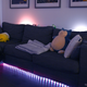 Using the Hue Sync app, you can basically set up lights anywhere in your room, including behind you.